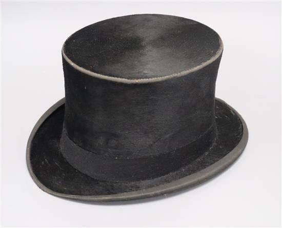 A leather top hat, boxed interior measurement 20 x 16cm